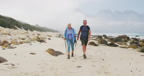 Active Senior Couple Hiking on a Beach