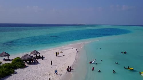 Aerial drone sky of tropical tourist beach by blue ocean with sand background