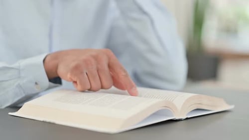 African Man Reading Book Close Up