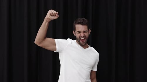 Man Celebrating Success with Exuberant Joy