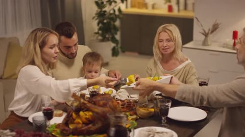 Family Meal with Thanksgiving Turkey and Wine