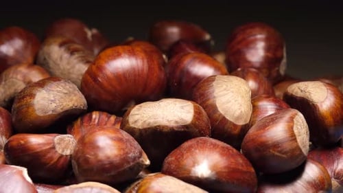 Chestnuts rotating. Autumn fall seasonal food.