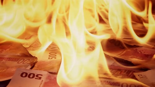 Euro Money Bills Burning in Intense Fire