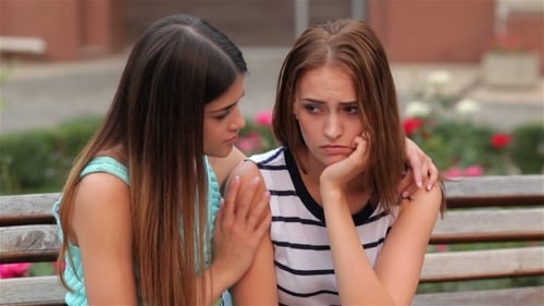 Woman Comforting her Crying Friend on a Bench