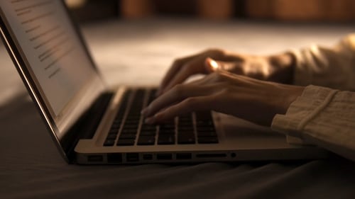 Hands Typing on Laptop Keyboard, Close Up