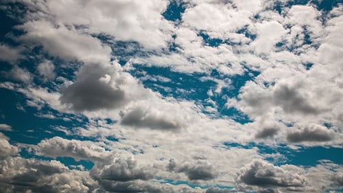 Clouds Moving Across a Beautiful Blue Sky