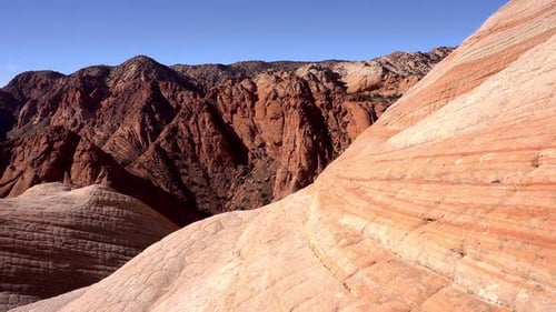 Moving over desert landscape viewing the colorful layers of sandstone