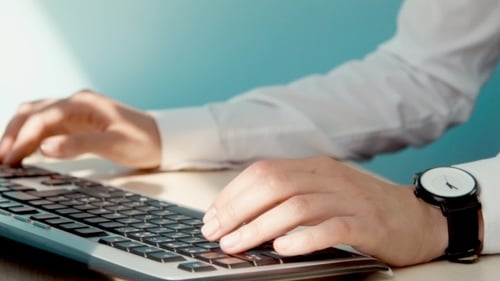 A Woman Working At a Computer