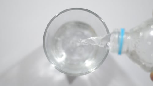Pouring Water in Glass