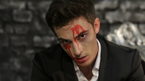 Man with Dark Makeup and Fake Blood
