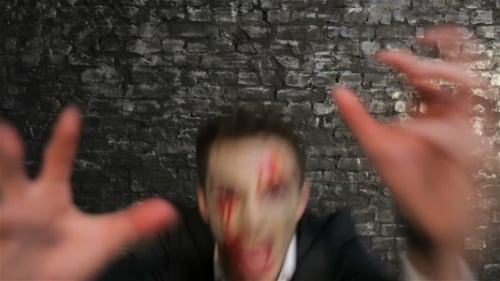 Man in Suit with Horror Makeup Zooms In