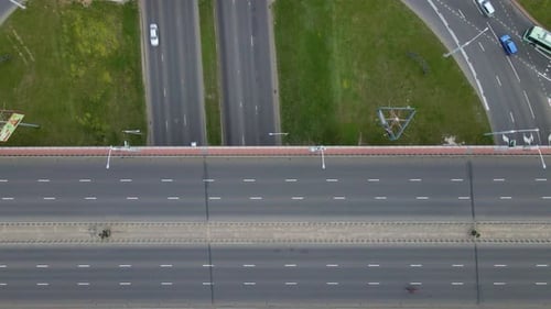 Flight Over City Roads. Above A Multilevel Road Junction, The Camera Is Lowered Down.