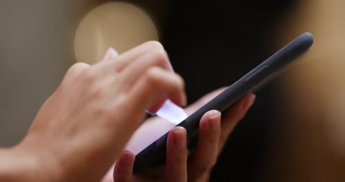Close up of woman using smart phone