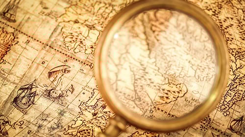 Antique Map with a Magnifying Glass Close Up