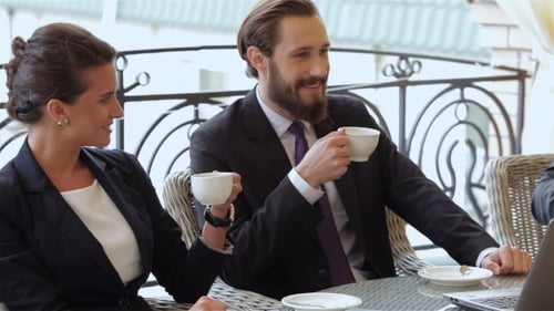 Business Colleagues Talking During Outdoor Coffee Break