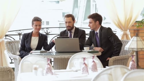 Business Colleagues Working Together on Laptop