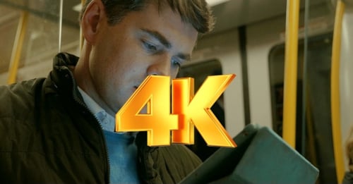 Man Using Tablet PC In Metro Train