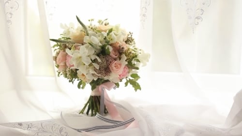Elegant Wedding Bouquet with Roses on White Fabric