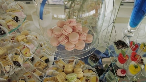 Elegant Dessert Table with Cakes and Macarons