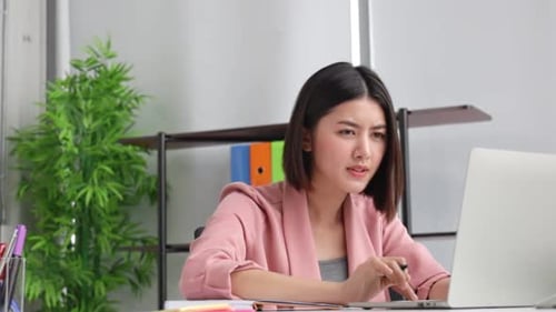 Young Asian business woman in office face portrait smile happy.