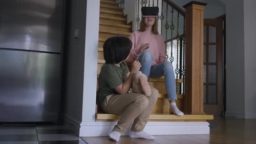 Kids Using Virtual Reality Headset on Stairs