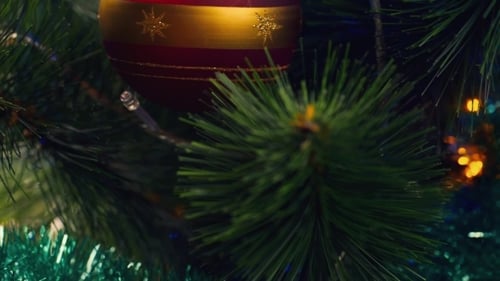 Close Up of Christmas Tree Ornament and Lights