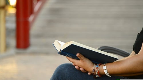 Reading a Book in a Park