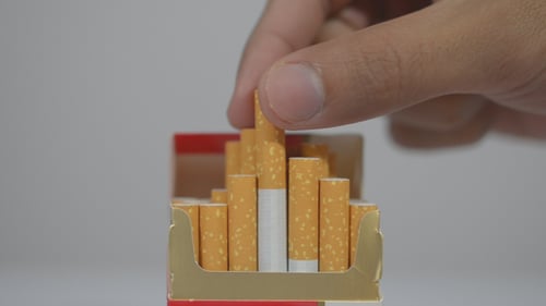 Taking Cigarette to Smoke