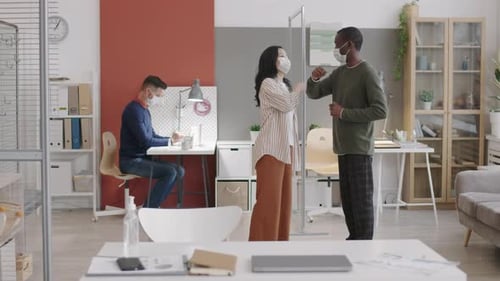 Office Workers Greeting Touching Elbows