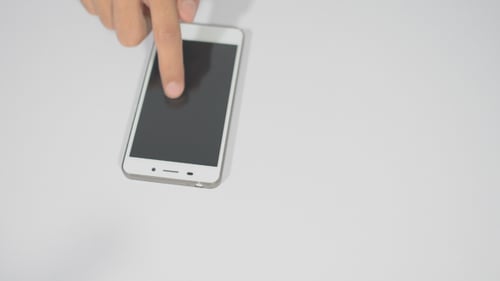 Hand Swiping Black Screen Smartphone