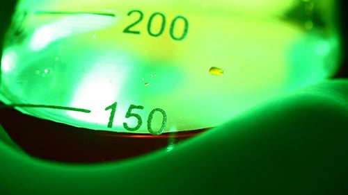 Erlenmeyer Flask Containing Red Liquid held by Hand