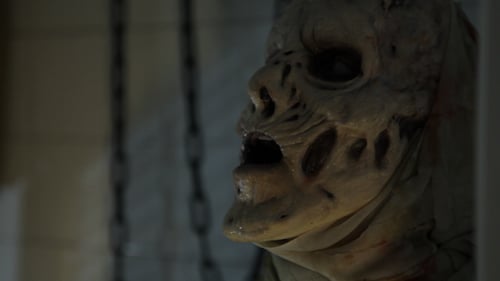 Close-up of Grotesque Monster Figure with Chains