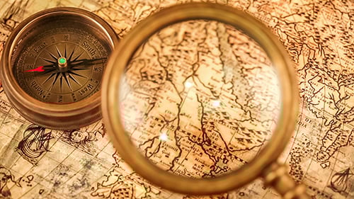 Antique Map with Compass and Magnifying Glass