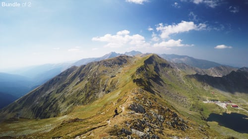 Scenic Hike Along Mountain Ridge on Sunny Day