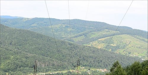 Scenic Mountain Village with Power Lines