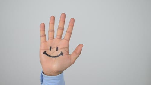 Lächelnde Hand