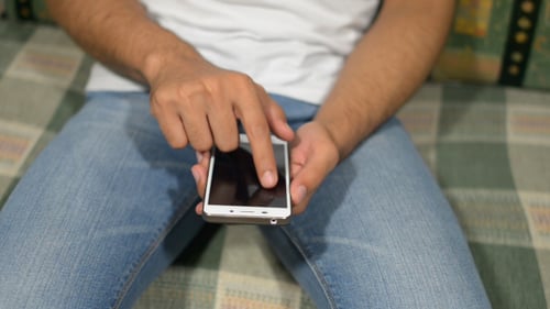 Young Man Using Smartphone