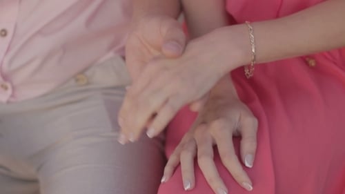 Man Puts The Ring On Woman Hand