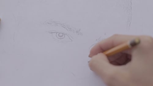 Hand Drawing Portrait Sketch with Pencil on Paper