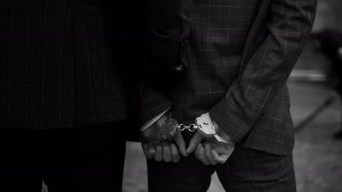 The Police Take the Handcuffed Prisoner to the Prison