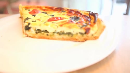 Vegetable Quiche Served On A Plate In A Restaurant 1