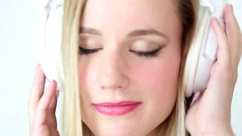 Close Up Of Beautiful Young Blond Woman Dancing With White Headphones 2
