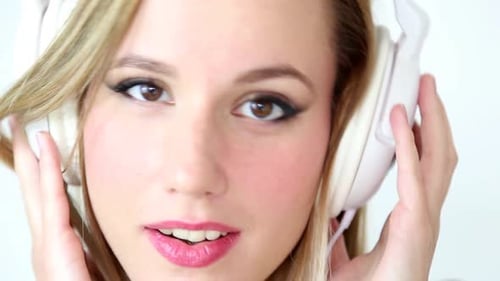 Close Up Of Beautiful Young Blond Woman Dancing With White Headphones 3