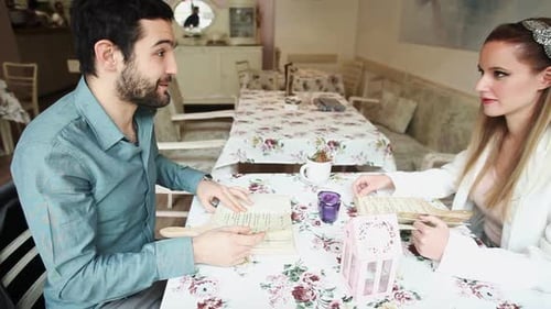 Couple In Restaurant Reading Menus 1