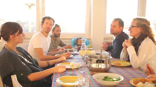 Friends Enjoying Meal Together at Sunny Home