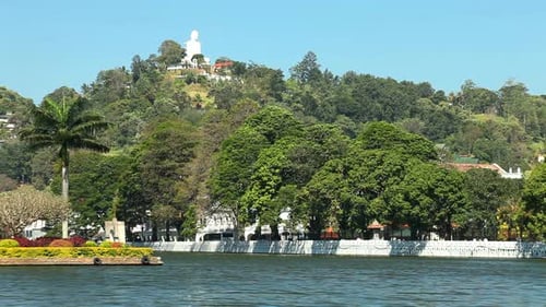 Kandy, Sri Lanka - February 2014: View Of Kandy Lake And Buddha Statue On Hill.