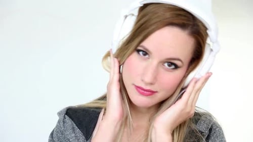 Woman Listening Music with White Headphones