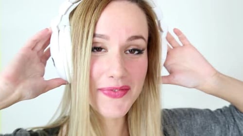 Woman With Headphones Listening to Music