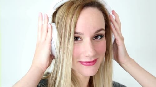 Blonde Woman Smiling with Headphones Close Up