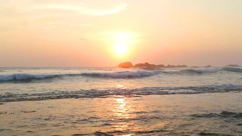 Ocean View In Hikkaduwa In Sunset With Waves Splashing The Beach. 9